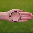 Polished Hematite Clipa purse hook in hand 