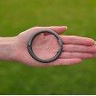 Matte hematite Clipa purse hanger in hand 